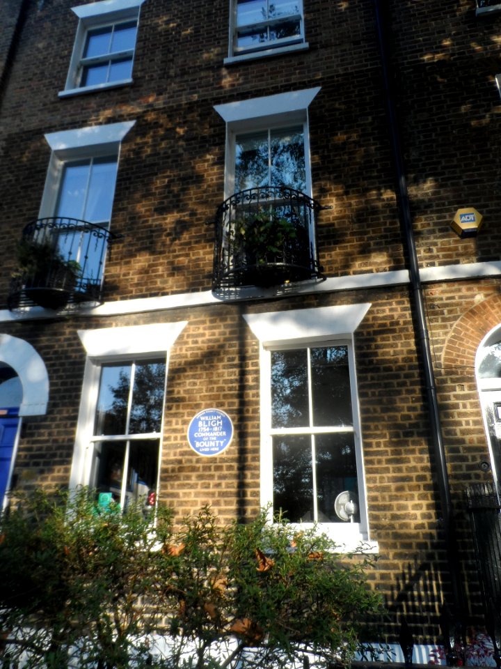 Blue plaque on building