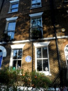 Blue plaque on building