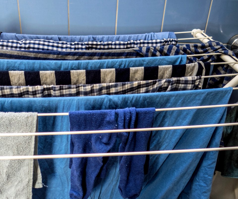Blue laundry on rack