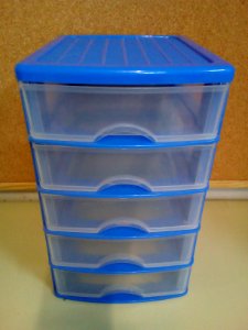 Blue plastic chest of drawers for desktop