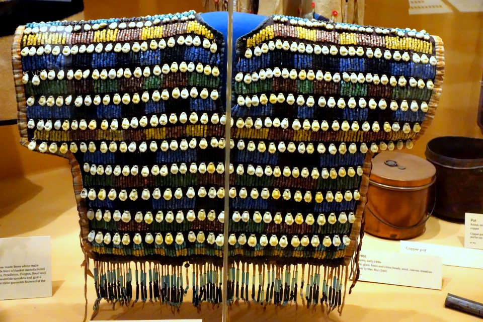 Bodice, Amsskaapipikani, early 1900s, cotton, glass beads, brass disks, cowrie shells, buckskin fringe - Glenbow Museum - DSC01062