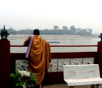 Bonze looking at the river