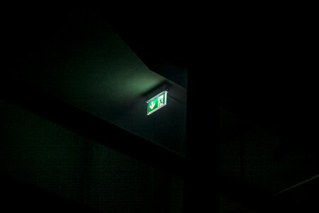 Emergency exit green dark photo