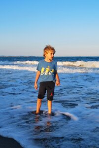 Standing watching sand