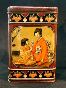 Blik met afbeelding van Oosterse vrouw met kind, foto 2