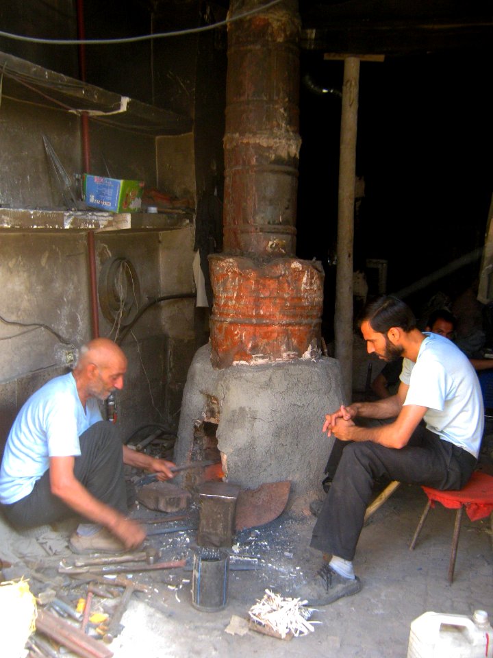 Blacksmith and his son in the Bazaar of Nishapur 5