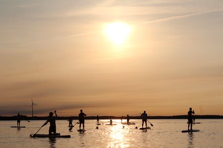 Stand up paddle paddle sunset