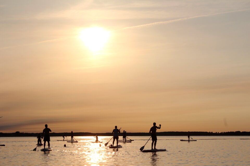 Stand up paddle paddle sunset