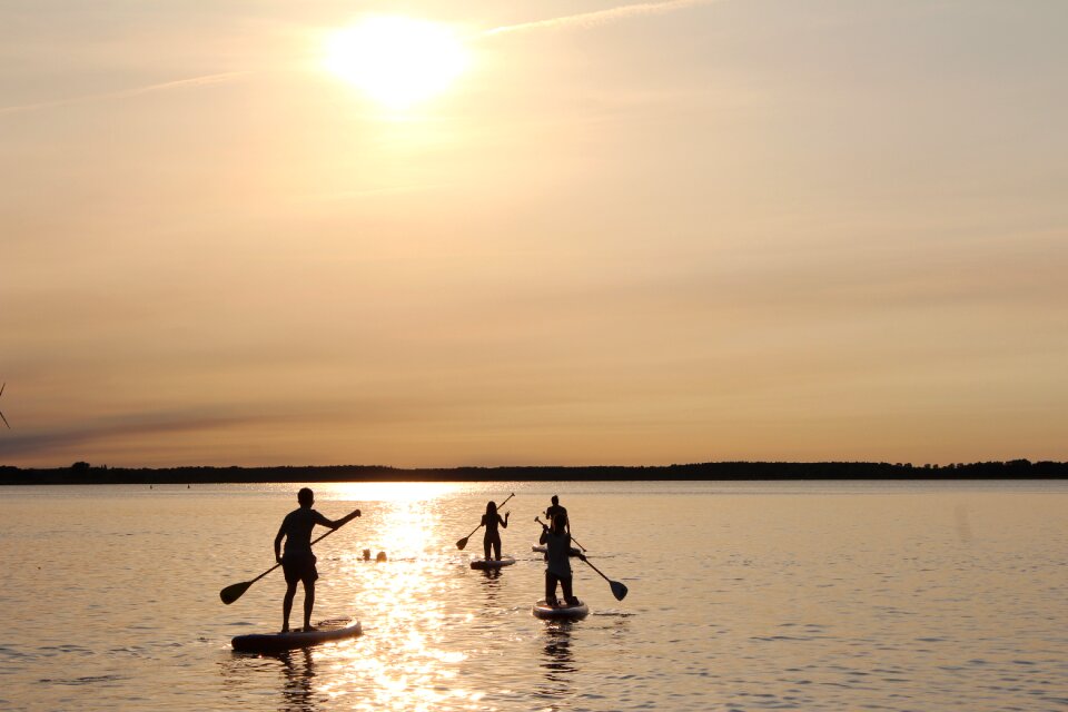 Stand up paddle paddle sunset
