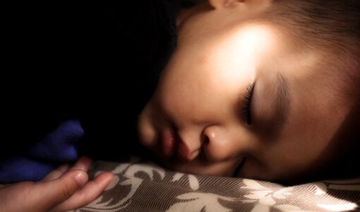 Child sleeping bed photo