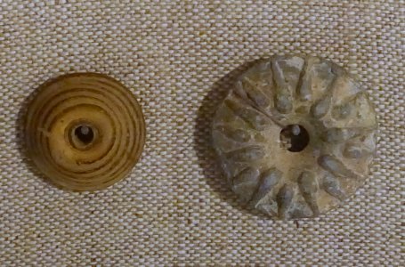 Buttons, Roman, left Italy, glass, right probably Italy, lead, both 1st-6th century AD - Spurlock Museum, UIUC - DSC05863