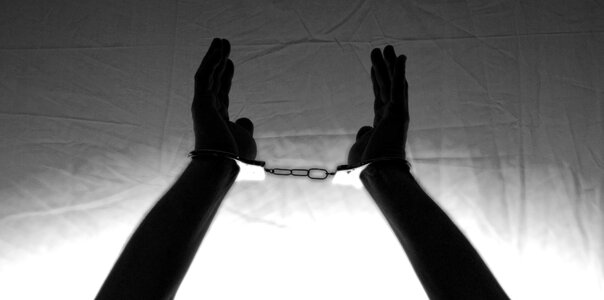 Bondage hands up crime photo