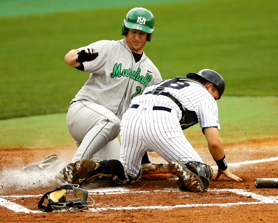 Home plate slide action photo