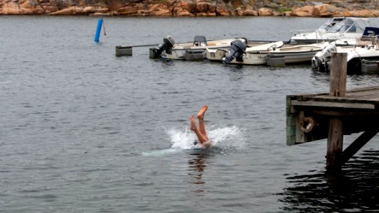 Boy diving from a jetty in Slävik