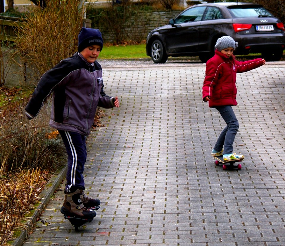 Boy and girl on skateboards