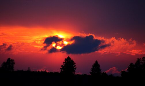 Setting sun afterglow clouds photo