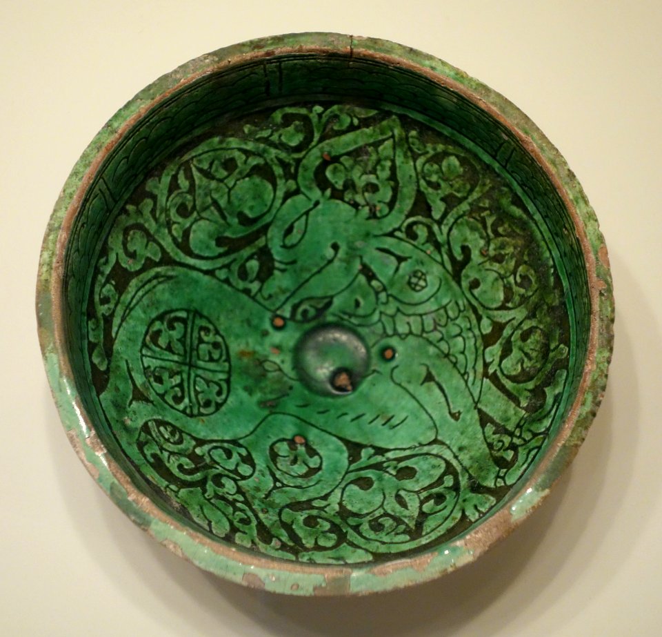 Bowl with prancing quadruped, Iran, Garrus district, Seljuk period, 12th or 13th century AD, earthenware with carved slip design under green glaze - Cincinnati Art Museum - DSC03988