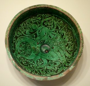 Bowl with prancing quadruped, Iran, Garrus district, Seljuk period, 12th or 13th century AD, earthenware with carved slip design under green glaze - Cincinnati Art Museum - DSC03988