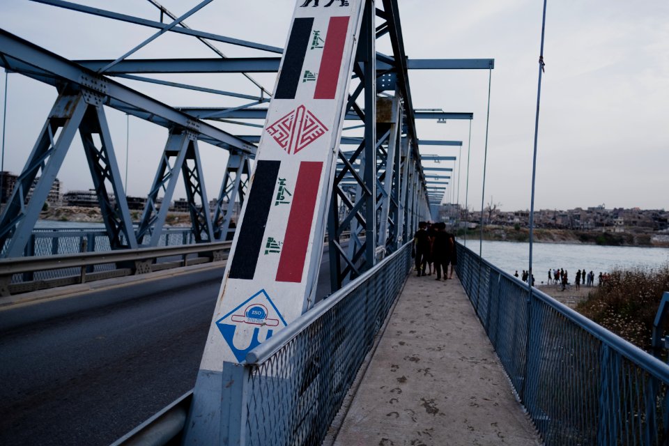 Boys playing and diving at the Old Bridge over the Tigris in Mosul in 2019 during the summertime 03