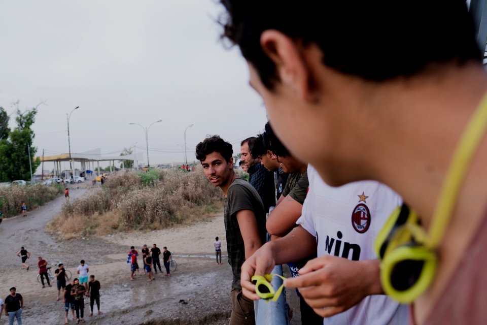 Boys playing and diving at the Old Bridge over the Tigris in Mosul in 2019 during the summertime 17