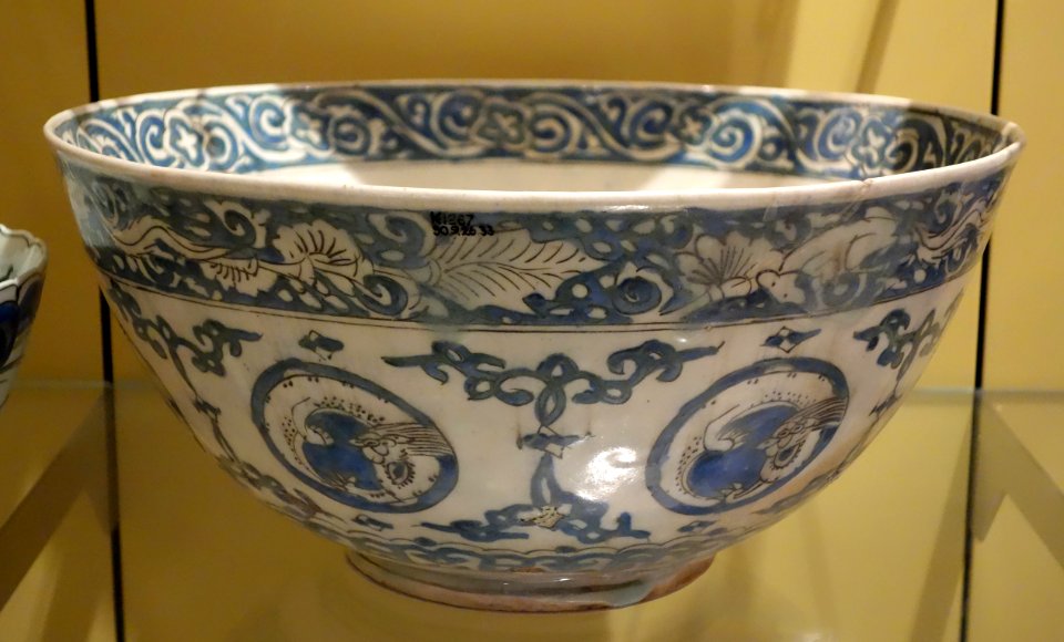 Bowl with curled dragons in medallions, based on a late 16th century Chinese model, five character-marks on base, view 2, Iran, Kirman, mid 1600s, underglaze-painted stonepaste - Royal Ontario Museum - DSC04795