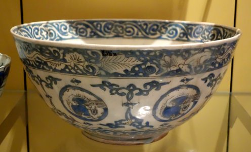 Bowl with curled dragons in medallions, based on a late 16th century Chinese model, five character-marks on base, view 2, Iran, Kirman, mid 1600s, underglaze-painted stonepaste - Royal Ontario Museum - DSC04795