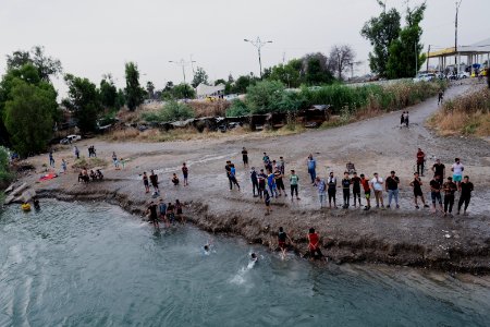 Boys playing and diving at the Old Bridge over the Tigris in Mosul in 2019 during the summertime 12