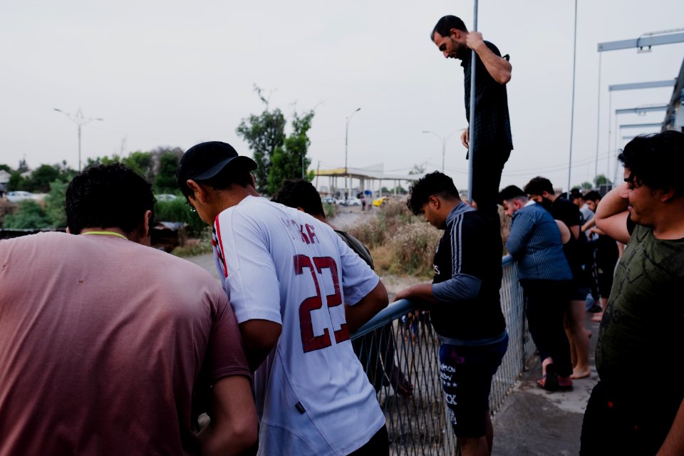 Boys playing and diving at the Old Bridge over the Tigris in Mosul in 2019 during the summertime 16