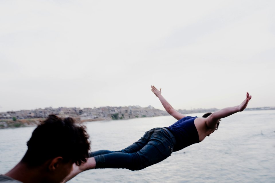 Boys playing and diving at the Old Bridge over the Tigris in Mosul in 2019 during the summertime 10