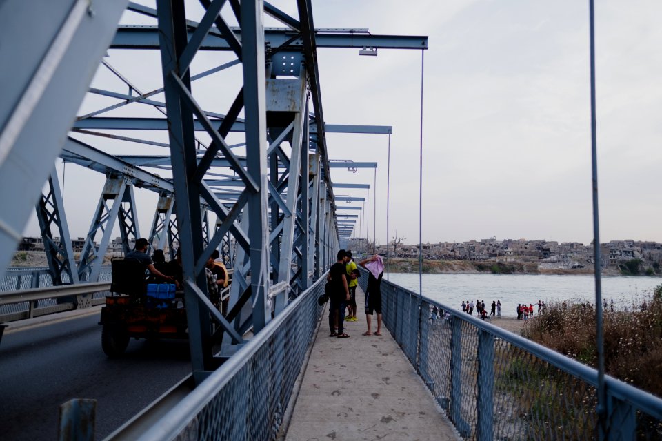Boys playing and diving at the Old Bridge over the Tigris in Mosul in 2019 during the summertime 04