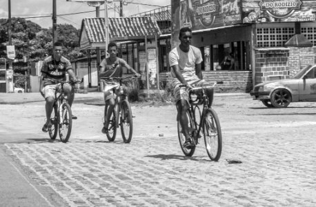Boys biking on Itamaracá, Pernambuco State of Brazil