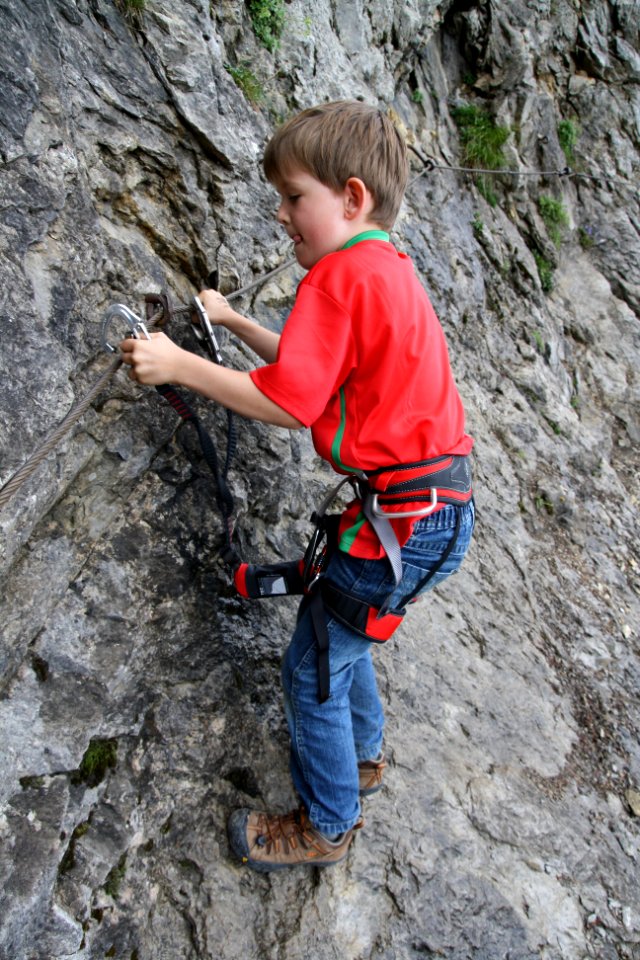 Boy with climbing harness