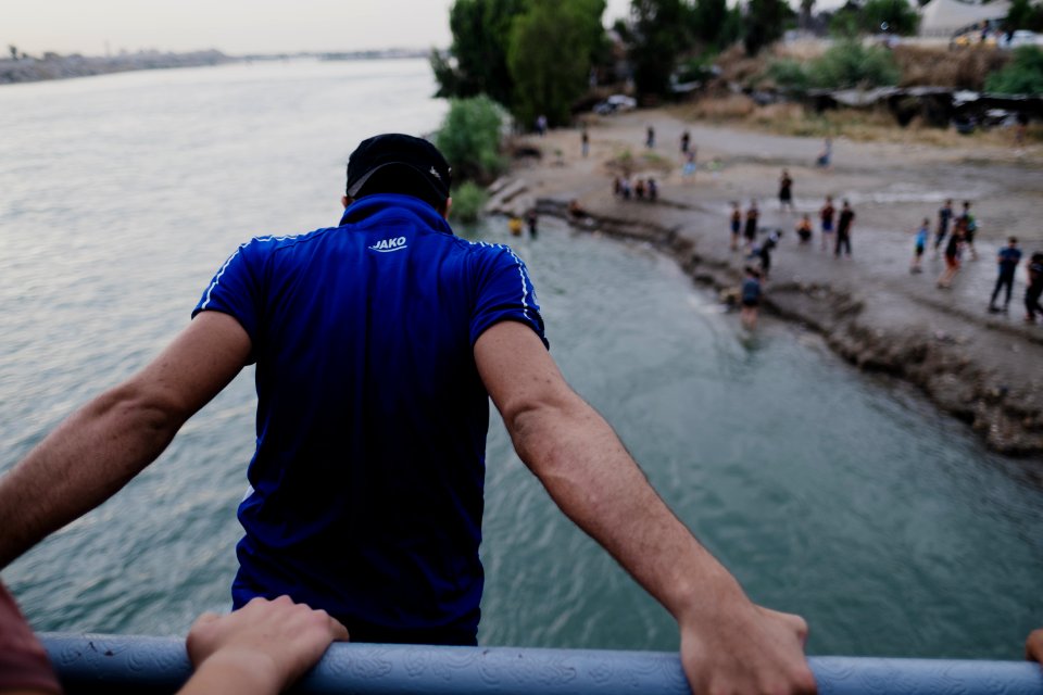 Boys playing and diving at the Old Bridge over the Tigris in Mosul in 2019 during the summertime 05