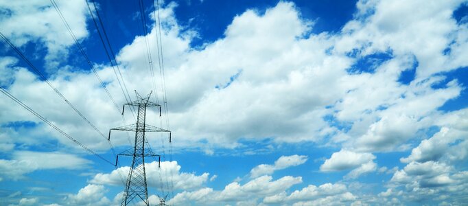 Power poles sky clouds photo