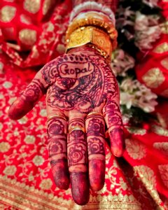 Brides hand full of Mehendi photo