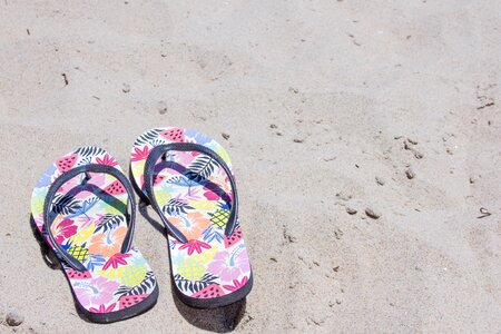 Flip flops sand beach photo