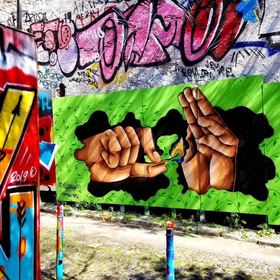 Caio Bless street art Lisbon hands fire 20190311