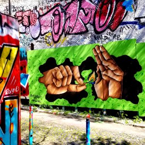 Caio Bless street art Lisbon hands fire 20190311