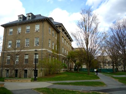 Campus buildings with lamppost and rooms with air conditioners at Cornell University photo