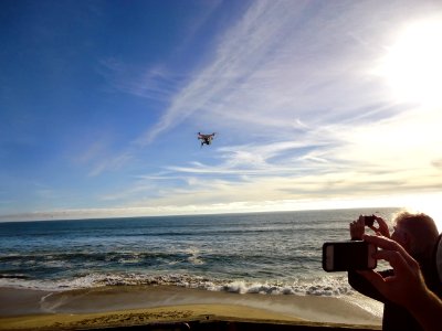 California photo of drone airborne over Pacific Ocean