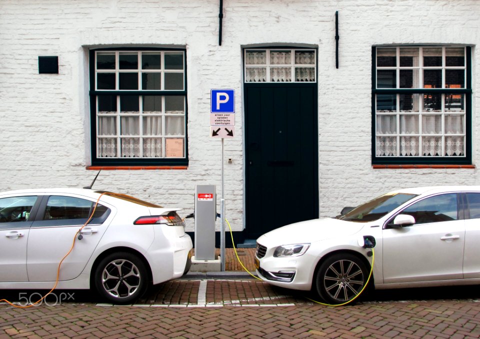Cars Plugged In At A Charging Pole 1 (244302395)