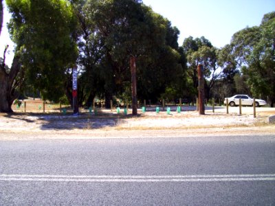Carved heritage poles at Preston Beach town entrance from across Mitchell Road (E37@WTW2013)