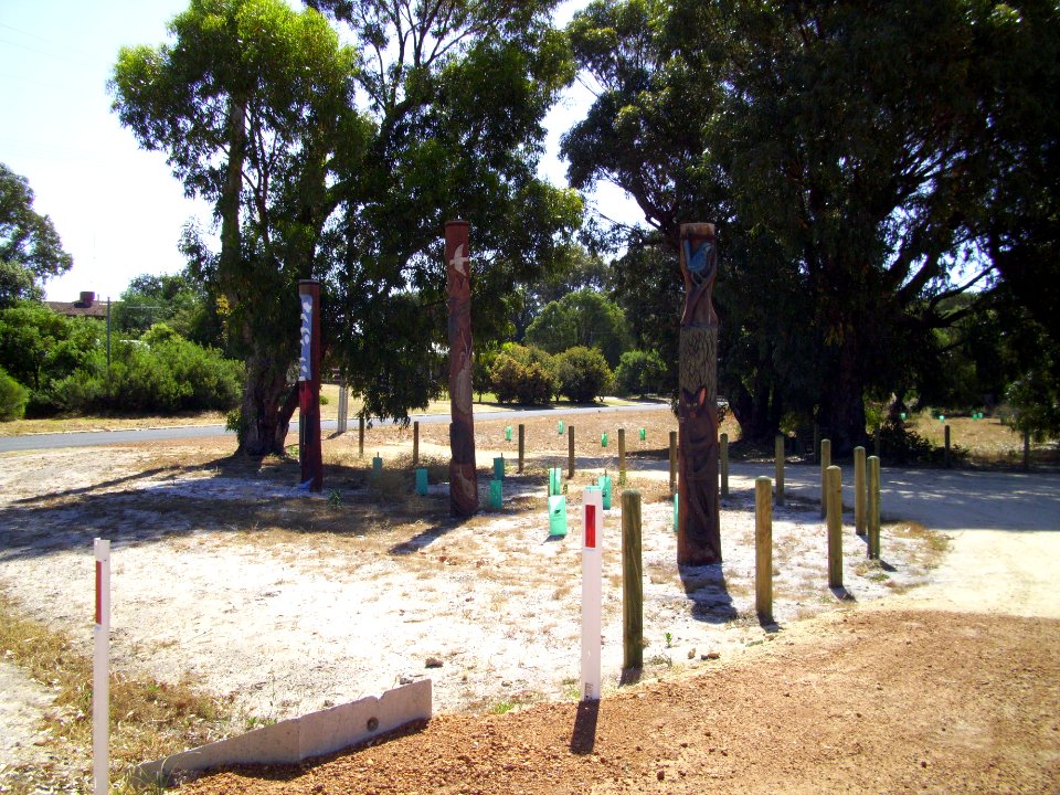 Carved heritage poles at Preston Beach town entrance (E37@WTW2013)