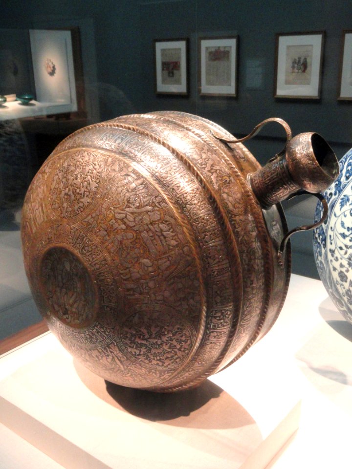 Canteen with Christian and Islamic motifs, probably northern Iraq, mid 13th century AD, brass inlaid with silver, view 1 - Freer Gallery of Art - DSC05397