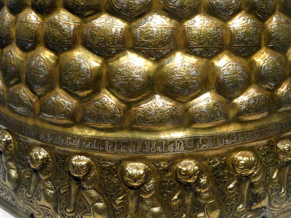 Candlestick, view 3, eastern Iran, 2nd half of 12th century AD, brass, hammered and chased, inlaid with copper, silver, and black organic material - Freer Gallery of Art - DSC05323