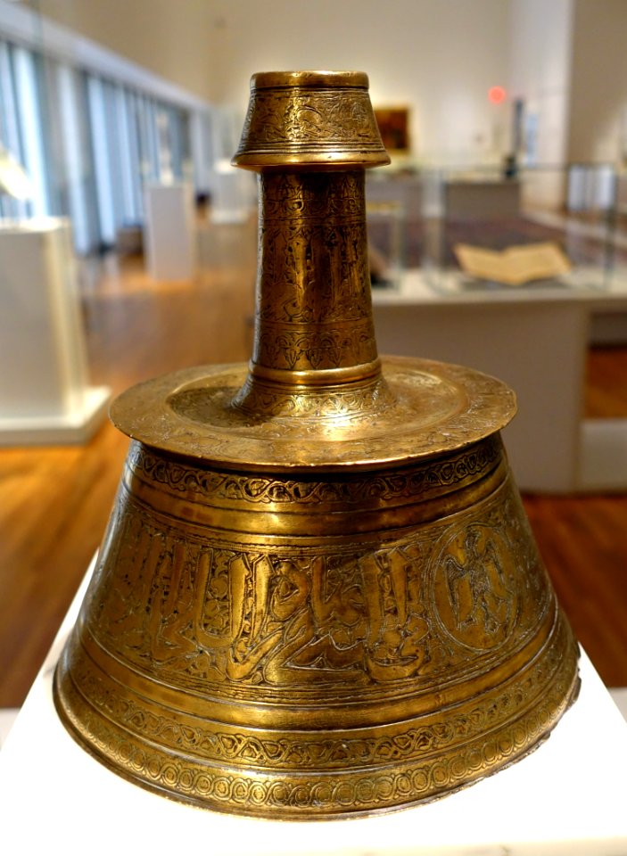 Candlestick, perhaps Egypt, late 14th century AD, brass, originally inlaid with silver, gold, and black paste - Aga Khan Museum - Toronto, Canada - DSC06827