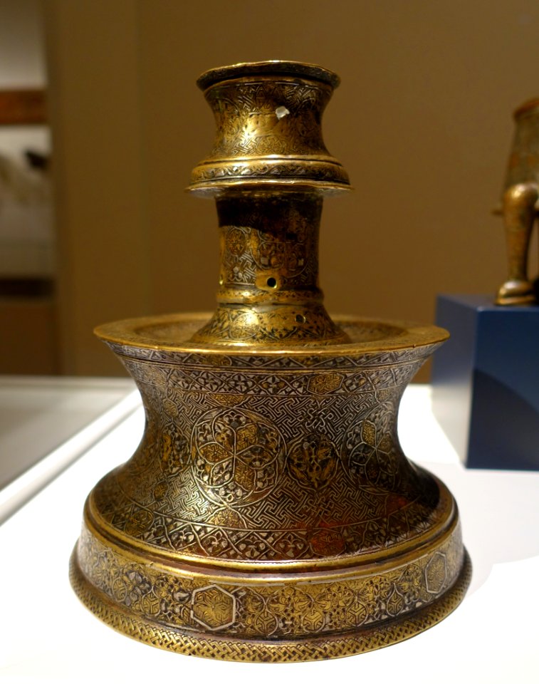 Candlestick, western Iran, late 13th to early 14th century AD, cast brass, silver and gold inlay, view 1 - Aga Khan Museum - Toronto, Canada - DSC06602