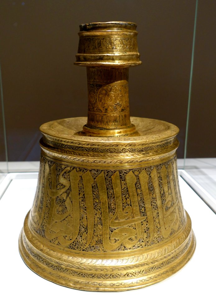 Candlestick, made for an amir of al-Malik an-Nasir, Egypt, 1293-1341 AD, brass, formerly silver and gold inlaid, with remains of black compound inlay - Aga Khan Museum - Toronto, Canada - DSC06522