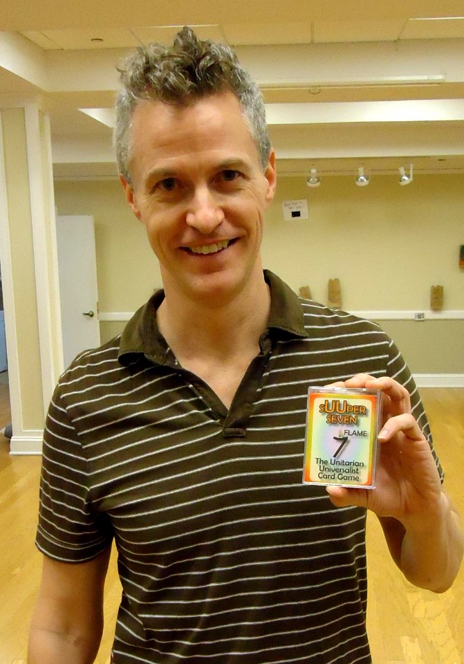 Card game creator Christopher Burtt with sUUper Seven cards