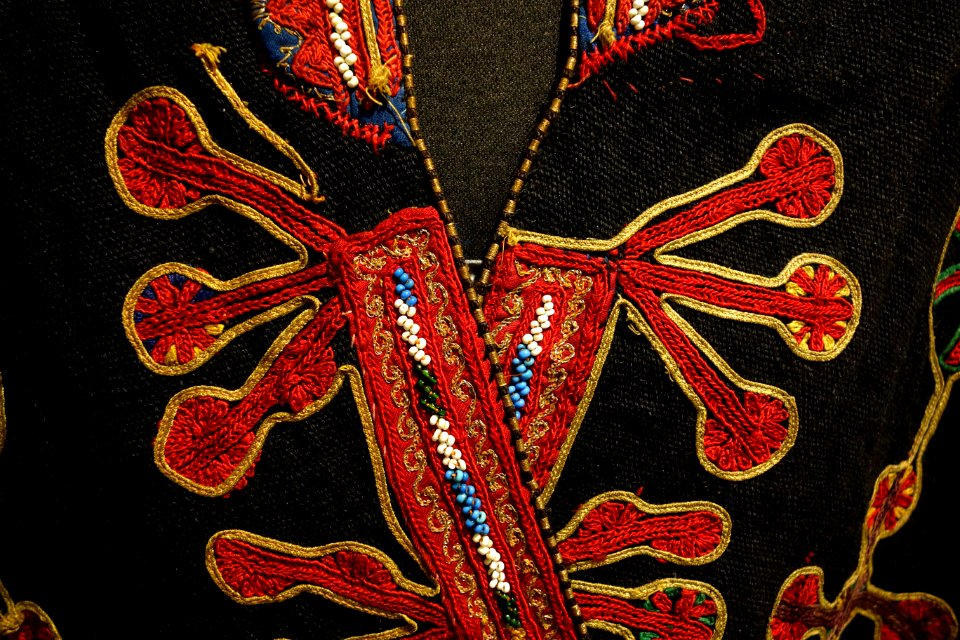 Coat, Mangal Pashtun people, Afghanistan, view 2, early to mid 20th century, wool, cotton, silk, metal thread, glass and plastic beads - Textile Museum of Canada - DSC00923